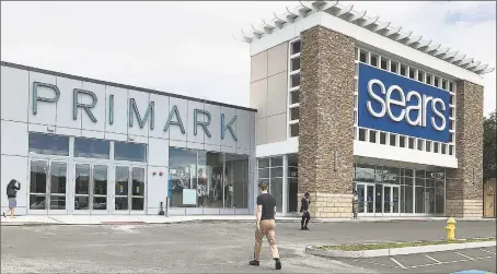  ?? Hearst Connecticu­t Media file photo ?? Customers walk into Primark at the Danbury Fair mall in Danbury in 2018. Primark took over space left vacant when Sears reduced its space at the mall.