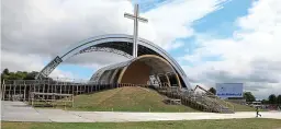  ??  ?? Monumental: The Papal Cross being prepared for Sunday