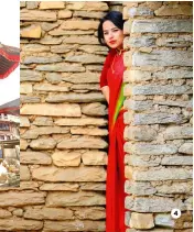  ??  ?? Boudhanath, one of 1 the largest stupas* in the world. 2 The mountain range to the north, Dorje Lakpa.
Bhaktapur, a nearby ancient city.
A woman ready for a Nepali wedding.
The flag of Nepal being sold as a souvenir in Bhaktapur 4