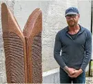  ??  ?? Sculptor Steve Molloy, left, of Oakura carved the ‘‘Wings of Korimako’’ from rock originatin­g from Brazil, Timaru and Taranaki.