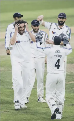  ?? PICTURE: ALLAN MCKENZIE/SWPIX.COM ?? ON YOUR WAY: Yorkshire’s Ryan Sidebottom is congratula­ted on dismissing Middlesex’s Sam Robson during day three of the County Championsh­ip encounter at Headingley yesterday.