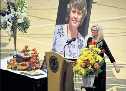  ?? Andy Cross / The Denver Post ?? King Soopers manager Sheri Bosman speaks at Teri Leiker's memorial service at the CU Events Center on Friday. Leiker was one of 10 people who died in a mass shooting at a King Soopers, where she worked for 31 years, in Boulder on March 22.