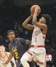  ?? Jeff Chiu / Associated Press ?? Stanford guard Daejon Davis shoots against Cal guard Juhwan Harris-Dyson at Haas Pavilion.