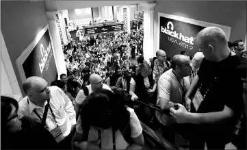  ??  ?? Attendees head to meeting rooms at the Black Hat informatio­n security conference in Las Vegas.