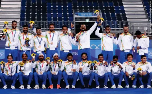  ??  ?? MAKING HISTORY: The victorious Indian men’s hockey team after beating Germany to an Olympic bronze medal