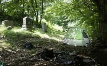 ?? Photos by Richard Beaven/The New York Times ?? A tent being used by a homeless person is erected at a cemetery in Brattlebor­o, Vt. Vermont has the second-highest rate of homelessne­ss per capita in the nation.