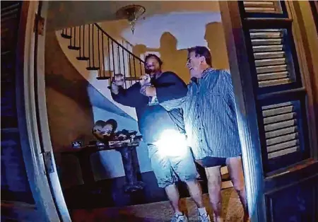  ?? San Francisco Police Department ?? Body-camera footage shows the seconds after San Francisco police arrived at the Pelosi home. Paul Pelosi struggles with an assailant over a hammer before his skull is cracked with it.