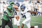  ?? MARC PENDLETON / STAFF ?? Northmont quarterbac­k Miles Johnson, who threw two long TD passes, eludes Fairmont’s Kahil Jones-Whitaker on Friday. The game was suspended because of weather and completed Saturday.