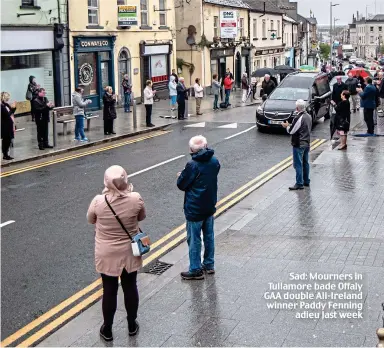  ??  ?? Sad: Mourners in Tullamore bade Offaly GAA double All-Ireland winner Paddy Fenning adieu last week