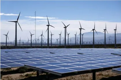  ?? Photograph: Mario Tama/Getty Images ?? Wind turbines operate at a wind farm near solar panels near Palm Springs, California, on 6 March 2024.