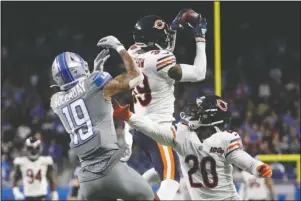  ?? The Associated Press ?? SAVING THE DAY: Chicago Bears free safety Eddie Jackson (39) intercepts a pass intended for Detroit Lions wide receiver Kenny Golladay (19) to seal the win over the Lions during the second half of Thursday’s game in Detroit.