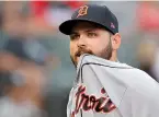  ?? AP Photo/Jim Young ?? ■ Detroit Tigers’ Michael Fulmer leaves the game after being struck by a ball hit by Chicago White Sox’s Daniel Palka on Sept. 3, 2018, in Chicago. Detroit beat pitcher Fulmer in the final salary arbitratio­n case this year. Fulmer was awarded a raise from $575,200 to $2.8 million; he had asked for $3.4 million.