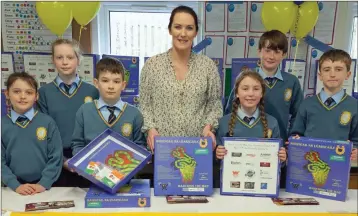  ??  ?? Sponsor Noelle Doyle of Dermot Doyle Butchers with April Fogerty, Faye Kennedy, Alex Muntean, Shanna-Rose McCarthy, Fenn Wolahan and Dara Tansey at the launch of Gaelscoil an Inbhir Mhóir’s boardgame, which they have entered in this year’s Junior...