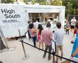  ?? SEAN LAUGHLIN/NORTHWEST ARKANSAS DEMOCRAT-GAZETTE ?? The High South on a Roll food truck is located in the midst of the Chihuly Exhibition at Crystal Bridges with fantastic sandwiches