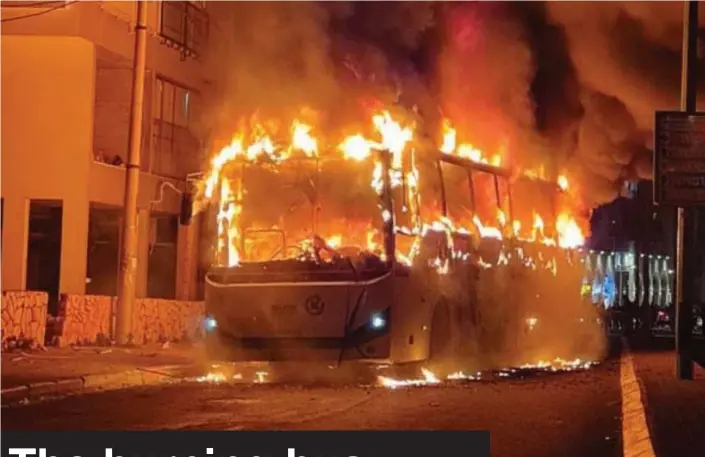  ?? (Israel Police Spokesman) ?? SIMMERING ANGER: The torched bus burns in Bnei Brak in late January.
