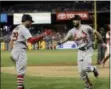  ?? MATT SLOCUM — THE ASSOCIATED PRESS ?? The Cardinals’ Matt Carpenter celebrates with Tommy Pham, left, after hitting the go-ahead home run during the ninth inning of Tuesday’s game in Philadelph­ia.