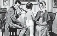  ?? ROBERT THOM/UNIVERSITY OF MICHIGAN ?? The painting “Laennec and the Stethoscop­e” by Robert Thom depicts Dr. Rene Laennec examining a young patient in 1816 at Necker Hospital in Paris.