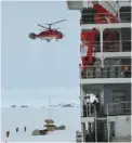  ??  ?? A helicopter unloads cargo from Xuelong at Zhongshan Station on Monday.