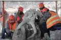  ??  ?? Archaeolog­ists from Mexico’s National Institute of Anthropolo­gy and History unearth remains, which include the bones of more than 10,000-year-old mammoths, from the constructi­on site of Mexico’s new internatio­nal airport, in Zumpango, near Mexico City.