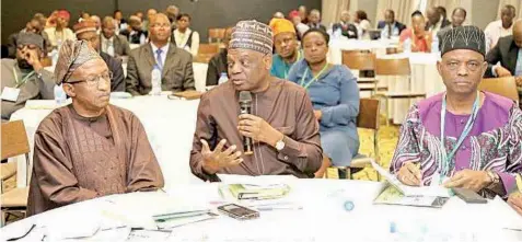  ?? ?? Executive Secretary of TETFUND, Sonny Echono ( middle), flanked by the representa­tive of the Executive Chairman ( FIRS), Mr. Abubakar Sadiq ( left) and the Provost, Federal College of Education ( Technical), Akoka, Yaba, Dr. Wahab Ademola Azeez ( right), during the 2022 TETFUND/ FIRS joint interactiv­e forum, held in Lagos.