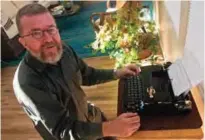  ??  ?? Joe Van Cleave, who runs a popular YouTube channel on restoring typewriter­s, speaks about one of his vintage typewriter­s at his home in Albuquerqu­e, NM. — AP photos