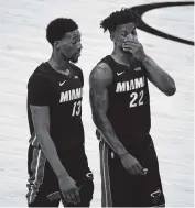  ?? DAVID SANTIAGO dsantiago@miamiheral­d.com ?? Bam Adebayo, left, and Jimmy Butler have had strong performanc­es over the Heat’s ongoing 9-3 stretch.