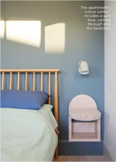  ?? ?? The apartment’s ‘colour syntax’ includes a soft blue, carried through into the bedroom