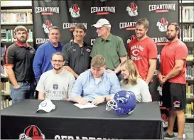  ?? Kevin Myrick / SJ ?? Steven Howard was joined by his family and coaches as he signed his commitment with Shorter University on Friday, Feb. 23.