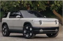  ?? COURTESY OF RIVIAN AUTOMOTIVE ?? Irvine-based Rivian Automotive on Thursday unveiled its R2, a midsized electric SUV that starts at about $45,000. The two-row SUV will be available in two battery pack sizes, with the larger option offering a range of more than 300 miles on a single charge.