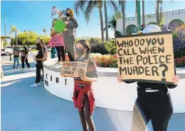  ?? GARY WARTH U-T FILE ?? Protesters gather earlier this year outside Escondido City Hall to demand police release the body-worn camera footage from the fatal April 21 shooting.