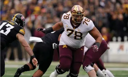  ?? ?? Australian Daniel Faalele playing for Minnesota as offensive tackle in an NCAA college game against Iowa. Photograph: Charlie Neibergall/AP