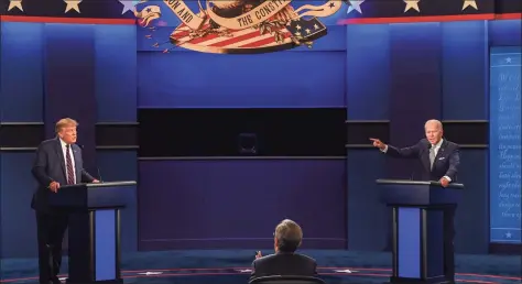  ?? Jim Watson / AFP via Getty Images ?? President Donald Trump and Democratic Presidenti­al candidate and former Vice President Joe Biden exchange arguments during the Sept. 29 presidenti­al debate at Case Western Reserve University and Cleveland Clinic in Cleveland, Ohio.