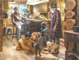  ?? STEVE RINGMAN/SEATTLE TIMES ?? Bill Biggs and Susan Headlee reconnecte­d — and married — about 35 years after their teenage summer romance in Oregon. They now live together (with dogs Cody and Hanna) in a 4,000-square-foot log home in Woodinvill­e, which they have updated and filled...