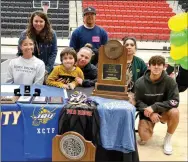  ?? ?? Liz Vazquez, left, signed a letter of intent for John Brown University track team. She was joined by family Ana Islas, brothers George and Kevin Vazquez, Beth Martinez and head coach Heather Wade.