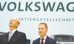  ?? ODD ANDERSEN / AFP / Gett y Imag es Files ?? VW supervisor­y board chair Hans Dieter Poetsch, left, and CEO Herbert Diess have vowed to fight new charges alleging they were too slow in informing investors of
their diesel findings.