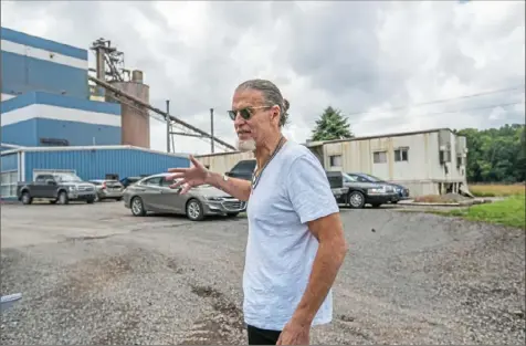  ?? Andrew Rush/Post-Gazette photos ?? Bill Spence, co-chairman of Stronghold Digital Mining, gives a tour July 23 of the Scrubgrass Generating Station, where large shipping containers house thousands of Bitcoin-mining machines.