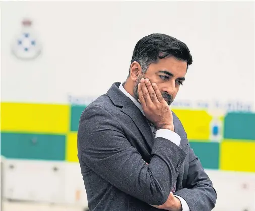  ?? Picture Andrew Milligan/PA ?? Scottish Health Secretary Humza Yousaf deep in thought in front of an ambulance at the Royal Infirmary Of Edinburgh in August