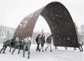  ?? LYLE ASPINALL ?? Students walk through the Trans Canada Pipeline Arch art installati­on at the University of Calgary. A recent survey reveals concerns with amenities and support for students.