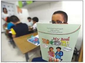  ?? (File Photo/AP/Fateh Guidoum) ?? A child shows his English lessons book Sept. 21, 2022, at a private school in Birkhadem.