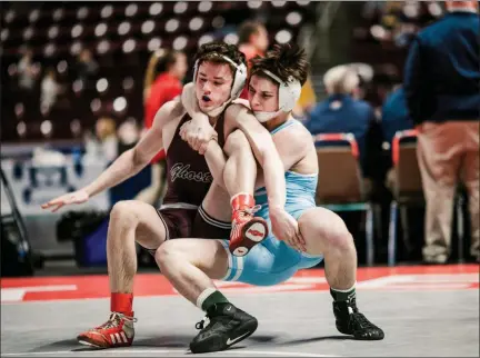  ?? NATE HECKENBERG­ER - FOR MEDIANEWS GROUP ?? Daniel Boone’s JT Hogan locks up a cradle against Abington’s Shane Kibler before pinning him at 145 pounds.