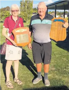  ?? ?? Karen Lee and Rodger Bagshaw with the Waihi trophies from the triangular tournament.