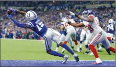  ?? SAM RICHE/TRIBUNE NEWS SERVICE ?? Indianapol­is Colts wide receiver Dontrelle Inman (15) hauls in this secondhalf touchdown catch for a score against New York Giants linebacker Tae Davis (58) on Dec. 23, 2018 in Indianapol­is.