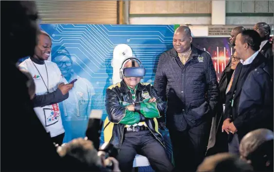  ??  ?? Alternativ­e reality: President Jacob Zuma tests a VR headset in the business lounge at the ANC policy conference. Photo: Oupa Nkosi