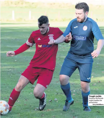  ?? Gerry Mcwilliams ?? Tough tackle Andrew Mckenzie (right) battles for possession