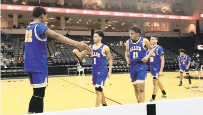  ?? KEITH GROLLER/THE MORNING CALL ?? Allen’s Nate Ellis walks off the court at PPL Center after scoring 30 points to help the Canaries post a 76-70 win over Dieruff in two overtimes Saturday in the first game of the Geico ESPN High School Basketball Showcase.