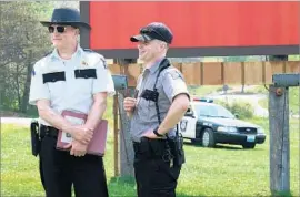  ??  ?? WOODY HARRELSON, left, and Sam Rockwell play lawmen in the savage farce.