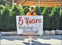  ??  ?? Tracey celebrates her fifth Big Move Cancer Ride back in 2013. This year marks her 10th year participat­ing as she continues to support local cancer care in Niagara.