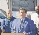  ?? Ryan Callihan / Associated Press ?? Florida Gov. Ron Desantis speaks during a news conference at the Piney Point reservoir on Tuesday.
