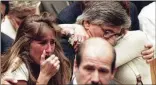  ?? AP 1995 ?? Fred Goldman (center, rear) hugs wife Patti as daughter Kim (left) reacts during the reading of the not-guilty verdicts in O.J. Simpson’s murder trial in 1995. The family later won a civil judgment.