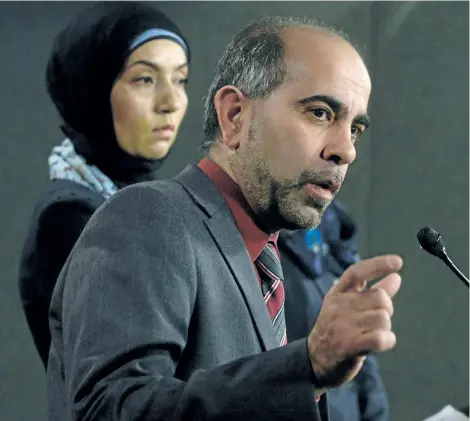  ?? ADRIAN WYLD/THE CANADIAN PRESS ?? Canadian Muslim Forum spokespers­on Samah Jebbari (left) listens as President Samer Majzoub responds to a question during a news conference on Parliament Hill in Ottawa, Tuesday.